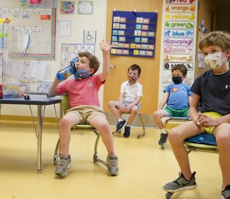 File photo of masked elementary school students attending a math lesson. MARY ALTAFFER / ASSOCIATED PRESS