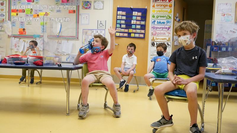 File photo of masked elementary school students attending a math lesson. MARY ALTAFFER / ASSOCIATED PRESS