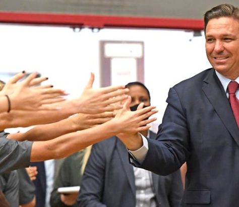 Gov. Ron DeSantis high-fives students in Sarasota